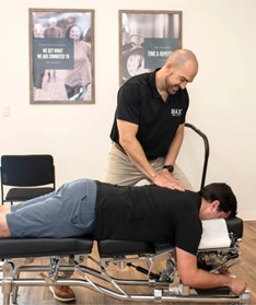 Chiropractor Huntsville AL Vinny Cuviello Adjusting Patient