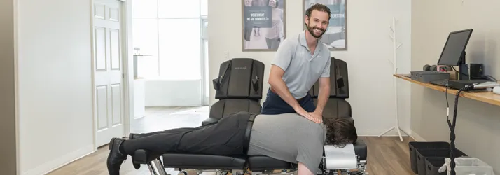 Chiropractor Huntsville AL Will Herrscher Adjusting Patient